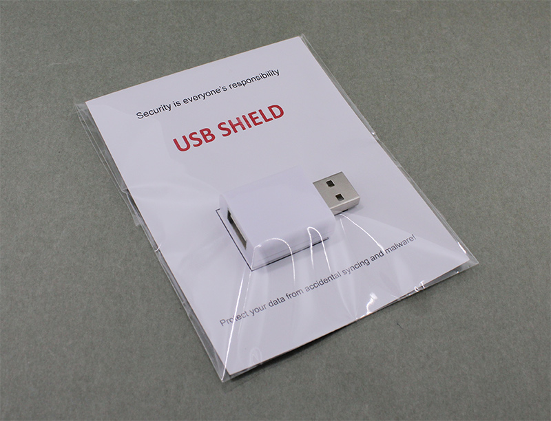 USB shield in backing card packing
